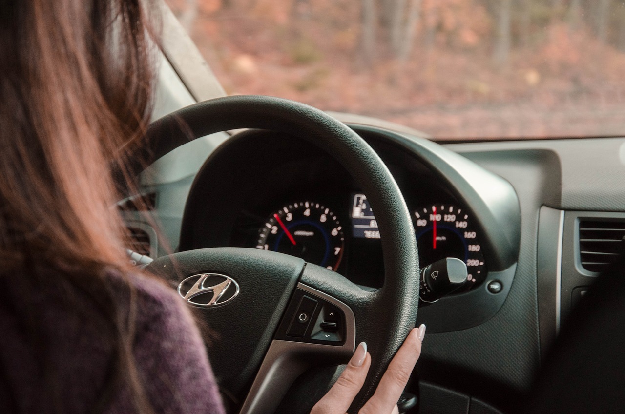 A student behind the wheel of a Hyundai vehicle