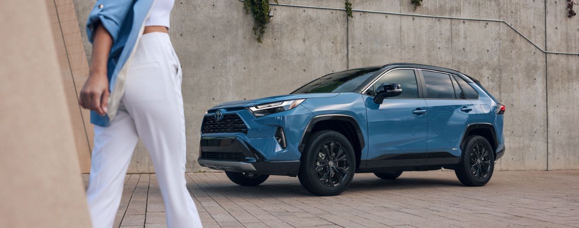 Person walking up to 2024 Toyota RAV4